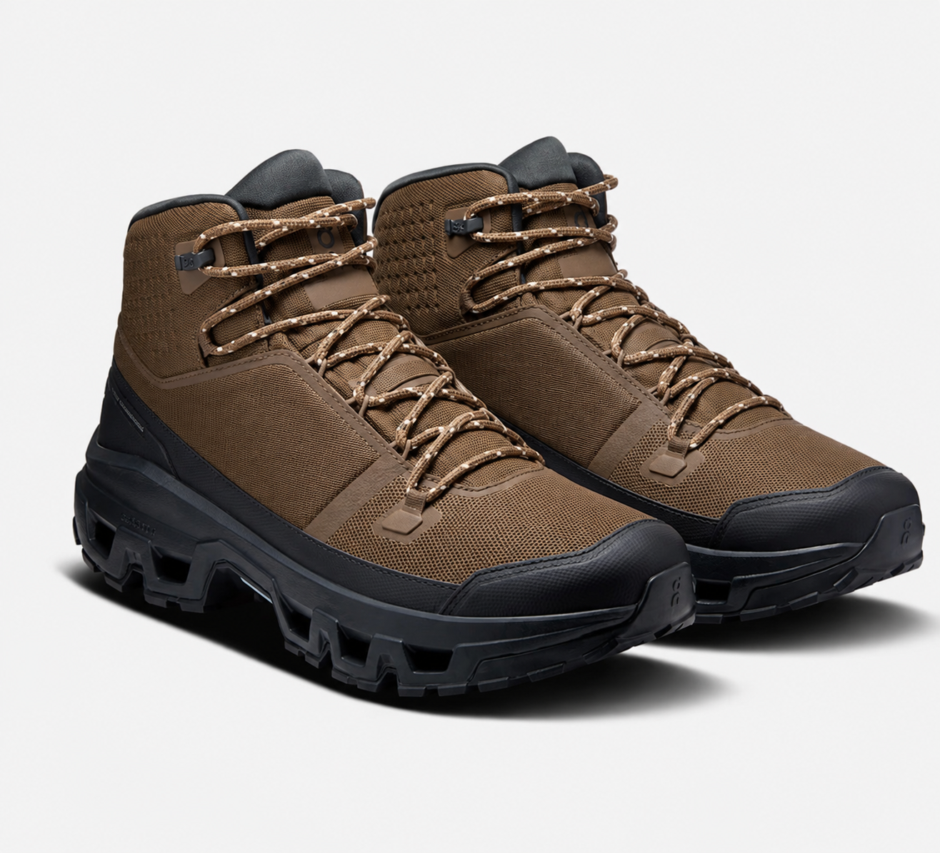 Earth-tone mid-cut hiking boot with speckled laces